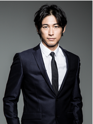 Dean Fujioka in a suit, looking at the camera