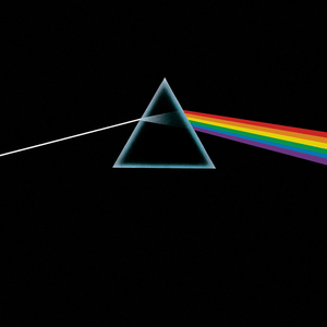 A prism refracting white light into a rainbow on a black background