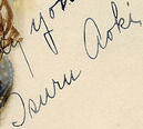 Portrait photograph of Tsuru Aoki by Nelson Evans and signed by Aoki (cropped to signature).jpg