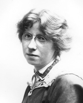 black and white headshot of a young woman with wavy hair