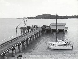 Boat docked at Bamaga jetty (undated)