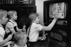 Girls interacting with the Winky Dink TV program