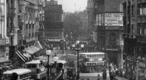 "Walter Scott of Bradford" crop of postcard showing Piccadilly Circus June or July 1932