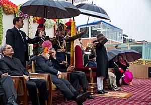 President Barack Obama speaks with Prime Minister Narendra Modi during the Republic Day Parade in New Delhi