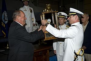 US Navy 090925-N-0683T-170 Retired Rear Adm. Dick Lyon, the first Bullfrog, left, passes the Bullfrog trophy to Capt. Pete Wikul, the 13th Bullfrog, during the passing of the Bullfrog ceremony