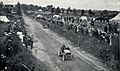 1903 Gordon Bennett Trophy. De Knyff passes Winton repairing his car