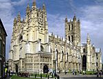 A beige-colored cathedral with various entrances.