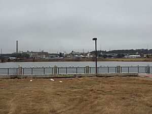 Fish Trap Lake Park in West Dallas, including the smokestack of the defunct RSR Corporation smelter in the background