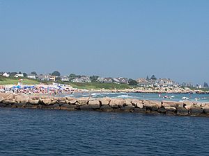 A photo of Weekapaug showing the breachway, jetty, channel, Fenway Beach, and numerous ocean front homes.