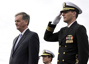 US Navy 081025-N-6553L-005 Cmdr. Mike Stevens, commanding officer of the Virginia-class attack submarine USS New Hampshire (SSN 778), right, and Vice Adm. John Donnally, Commander Submarine Force, center, salute as honors are r