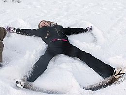 Child making Snow Angel