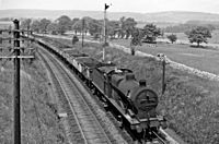 Hassop station up empties approaching (remains of) geograph-2791559-by-Ben-Brooksbank