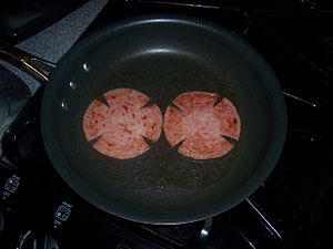 Pork roll slices frying