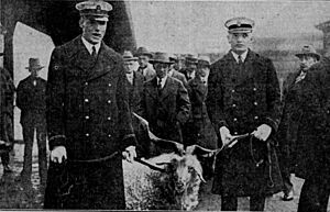 Midshipmen H. R. Page and W. C. Specht with "Old Bill", the Navy football team mascot