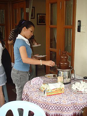 Woman-using-chocolate-fountain