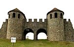 Stone gate with two towers and two arched passes