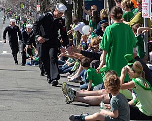Flickr - Official U.S. Navy Imagery - A Sailor shakes hands with spectators during the 111th annual St. Patrick's Day parade.
