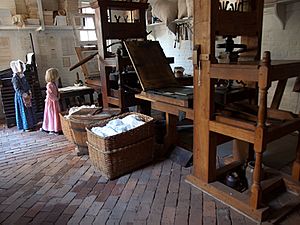 Girls inspecting eighteenth century press