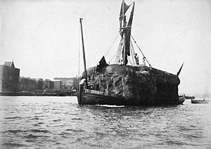 The hay barge ‘Unity’ passing Wapping Dock Stairs bound up, with Lower Gun Wharf and New Crane Wharf on her starboard broadside