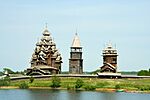 Two old wooden churches and a clock tower