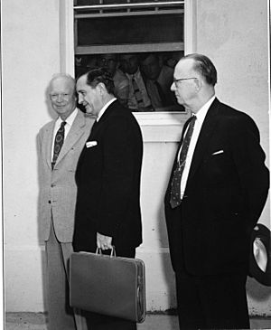 Photograph of President Dwight D. Eisenhower, Arkansas Governor Orval E. Faubus and Arkansas Congressman Brooks Hays at the Naval Base in Newport, Rhode Island, following a Two Hour Conference on the Little Rock S(...) - NARA - 7865613