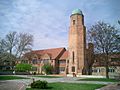 A large brick building with a central tower