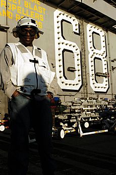 US Navy 041211-N-8273J-197 Television and movie actor Mekhi Phifer poses for a photo on the flight deck aboard the aircraft carrier USS Nimitz (CVN 68) during a recent tour of the ship