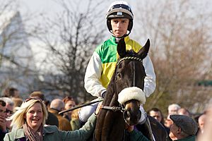 Leighton Aspell riding Many Clouds.jpg