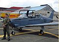 US Navy 070901-N-1713L-013 2nd Lt. Hanz Zimmermann, a Panamanian T-35 pilot, stands near his aircraft after returning to Tocumen International Airport from maritime surveillance as part of the Combined Forces Air Combatant Comm