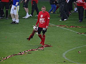 Craig Bellamy with Championship trophy