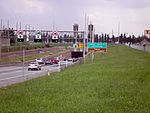 An entrance of the Louis Hippolyte Lafontaine tunnel, with a sign telling drivers that they are about to cross the Saint Lawrence.