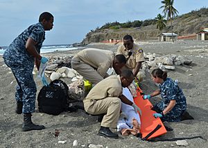 US Navy 120203-N-CD652-001 U.S. Naval Hospital Guantanamo Bay emergency technician (EMT) trainees work with Naval Station Guantanamo Bay firemen to