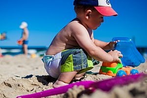 Baby playing on the beach