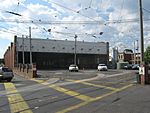 A photo of Camberwell tram depot shed, with one tram, a B class tram inside