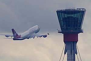 London Heathrow tower and Virgin B747 (5048342074) (2)