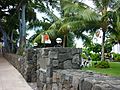 Stone wall and gate with musicians in the yard