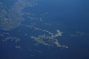 Aerial view of Cedar Key and its outlying islands, illustrating the extremely small size of the city:  The fork at State Road 24 and County Road 347 (the only two access roads) can be seen in the upper left.