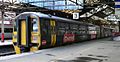 158819 in Ginsters livery at Crewe railway station (cropped)