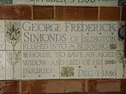 A tablet formed of five tiles of varying sizes, bordered by yellow and blue flowers in an art nouveau style