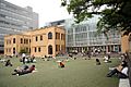 Sitting people reading outdoors at Kyoto International Manga Museum 20080608