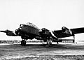 Avro Lancaster B Mk I (Special) of No. 617 Squadron, loaded with a 'Grand Slam' 22,000-lb deep-penetration bomb, running up its engines at Woodhall Spa, Lincolnshire, 1944. MH4263