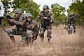 Indian Army soldiers move into position while demonstrating a platoon-level ambush to U.S. Army paratroopers during Yudh Abhyas 2013