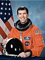 Richard Husband, NASA photo portrait in orange suit