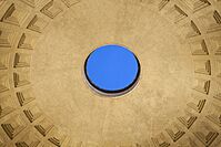 Close interior photo of the Pantheon's circular oculus opening at the center of the domed ceiling