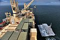 US Navy 110303-M-0074F-169 A crane offloads a beach landing module from USNS Sgt. William Button (T-AK 3012) near Camp Pendleton, Calif., during Pa