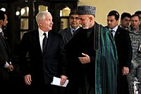 Gates with karzai