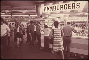 HAMBURGER STAND OFFERS CUSTOMERS A QUICK BITE WHILE WAITING FOR THEIR SUBWAY TRAIN ON THE 42ND STREET STATION... - NARA - 556816