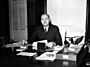 José Miguel Gallardo (sitting at his desk) (pro shot) (from large print) (200dpi).jpg