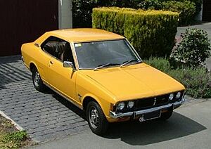 Mitsubishi Galant Yellow on a driveway