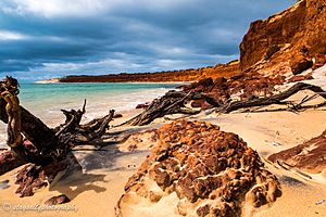 Red cliffs at Bottle Bay